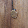 back of bronze ether element layering talisman necklace
