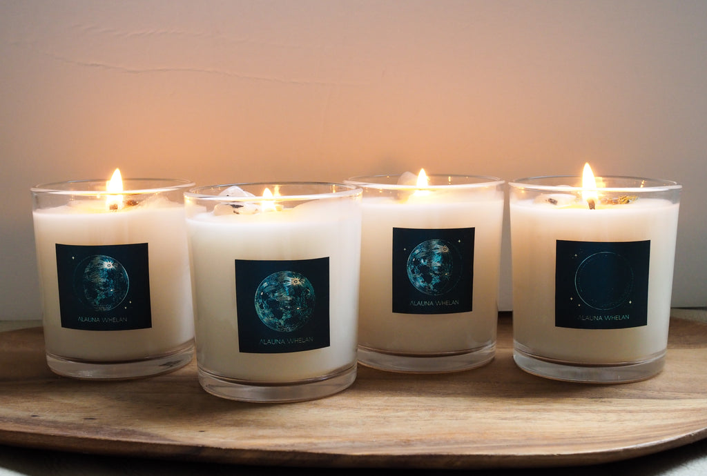 set of four soy lunar candles with blue and gold metallic labels