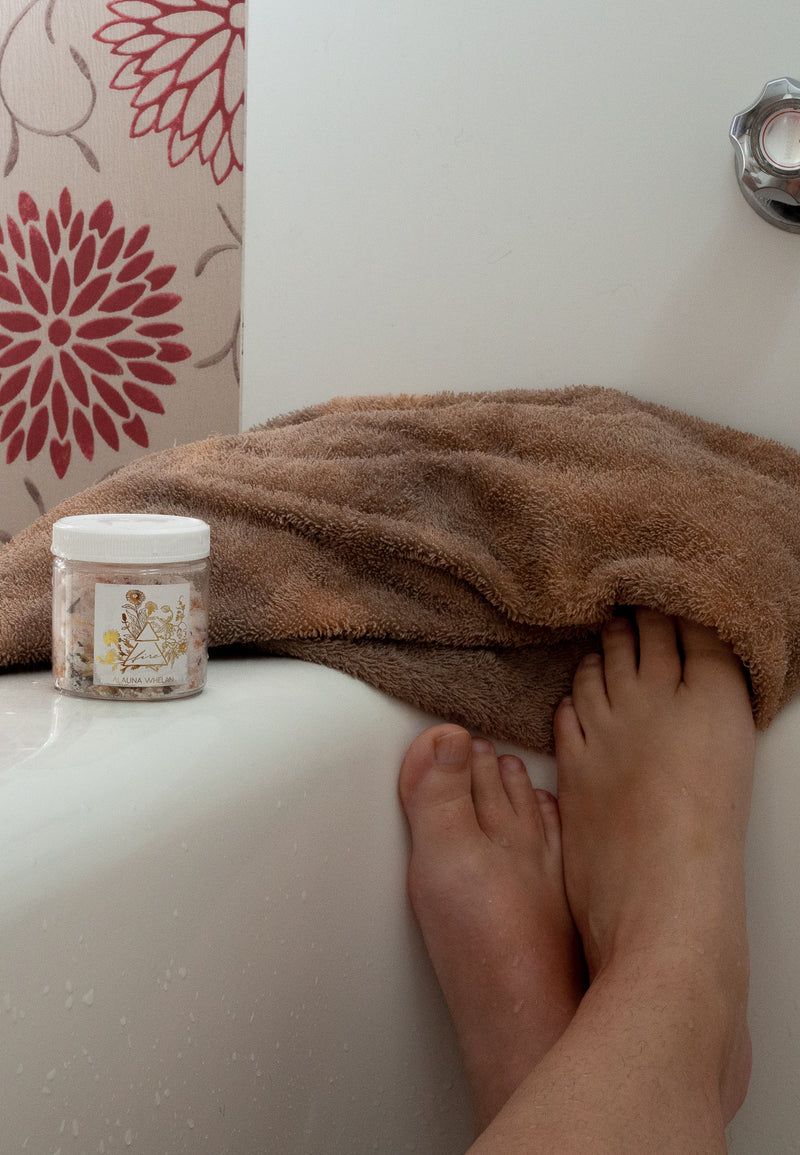 woman's legs, towel, bath tub and bath salts