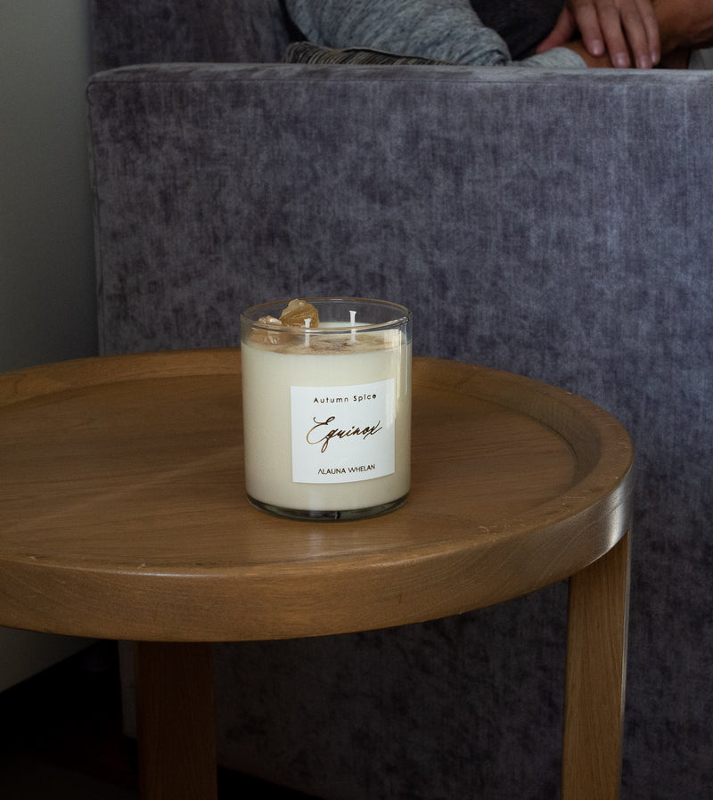 autumn spice candle on wooden side table
