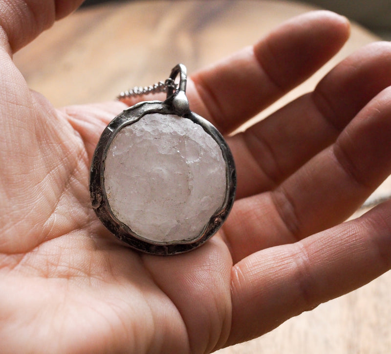 large quartz crystal moon healing crystal talisman necklace in palm of hand