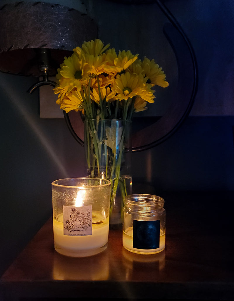 lit luxury soy element and full moon candles with fresh yellow florals