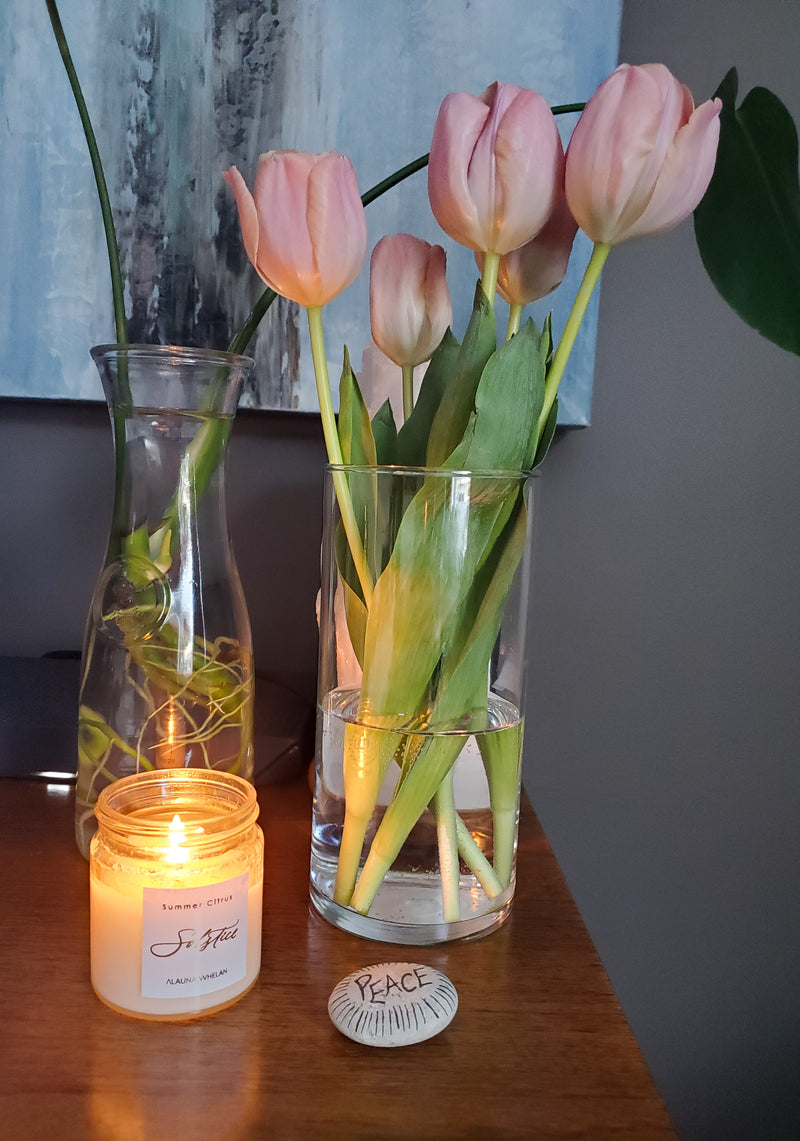 soy summer solstice candle with peace rock and tulips