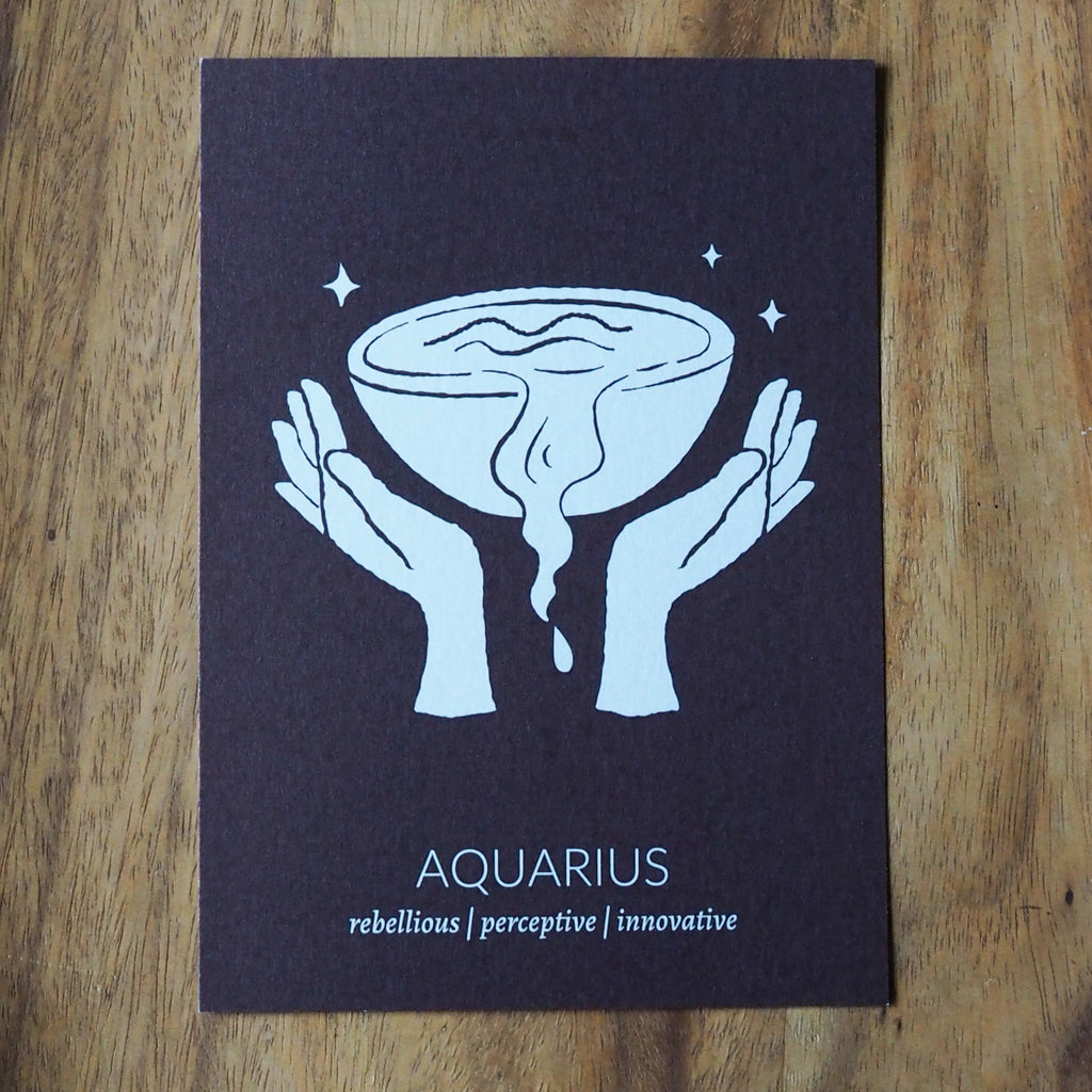 aquarius zodiac astrology print on wooden background