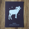 aries zodiac astrology print on wooden background