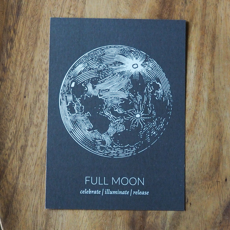 grey full moon lunar print on wooden background