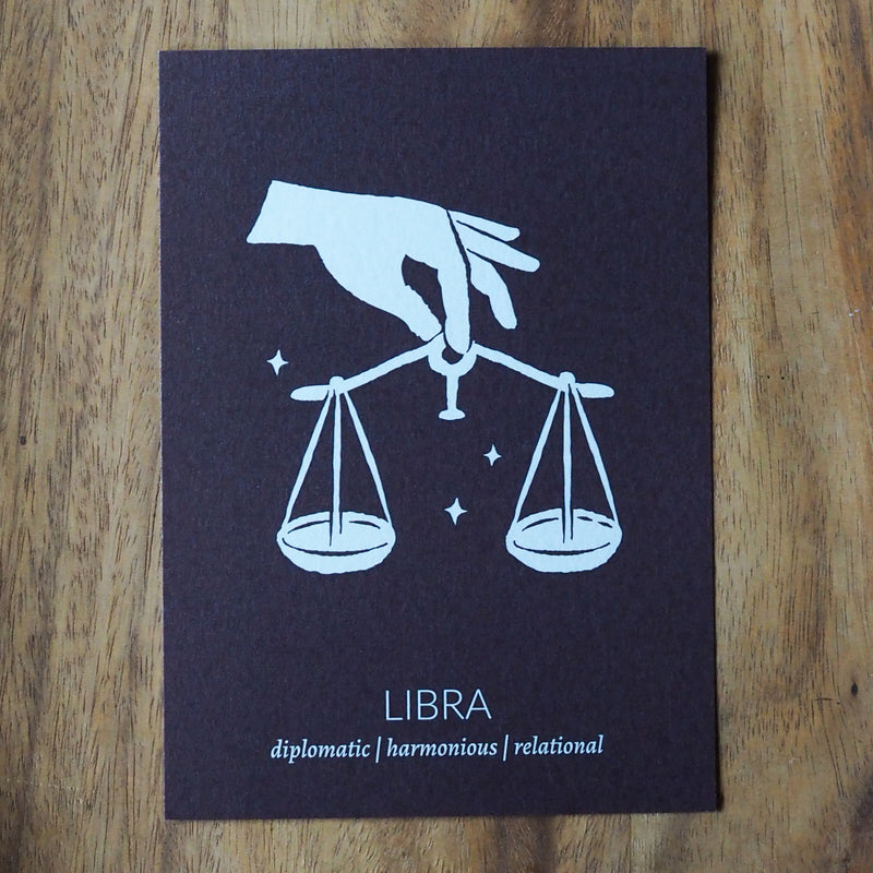 libra zodiac astrology print on wooden background