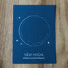 new moon lunar print on wooden background