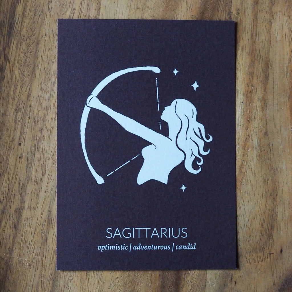 sagittarius zodiac astrology print on wooden background