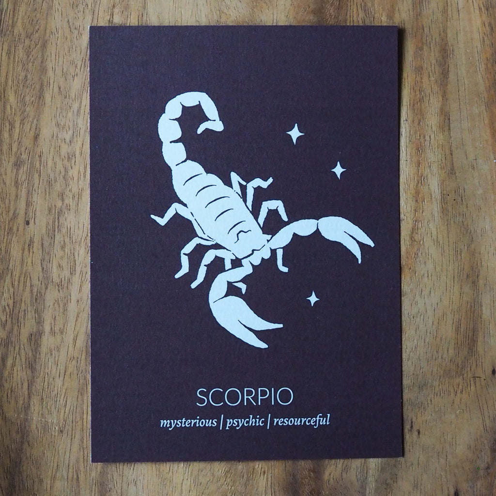 scorpio zodiac astrology print on wooden background