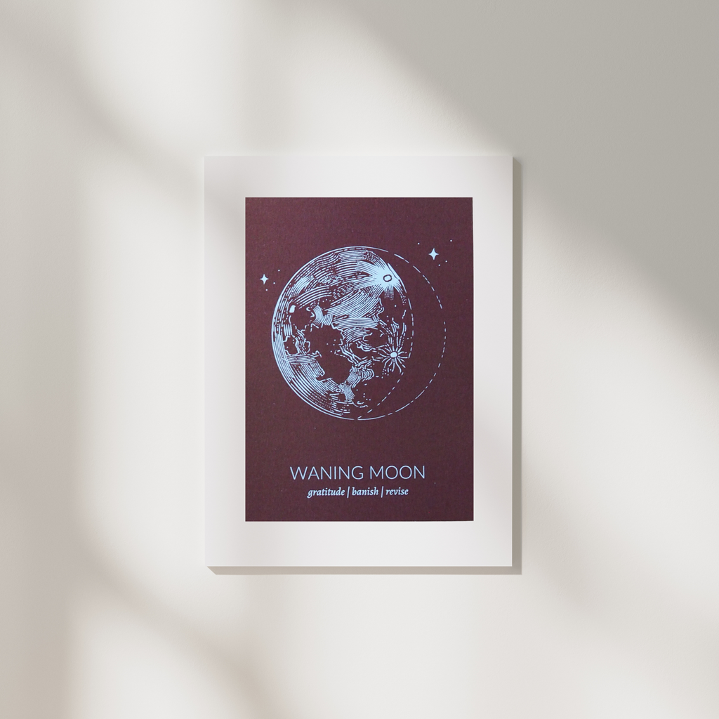 rust colored  waning moon lunar phase print in white frame