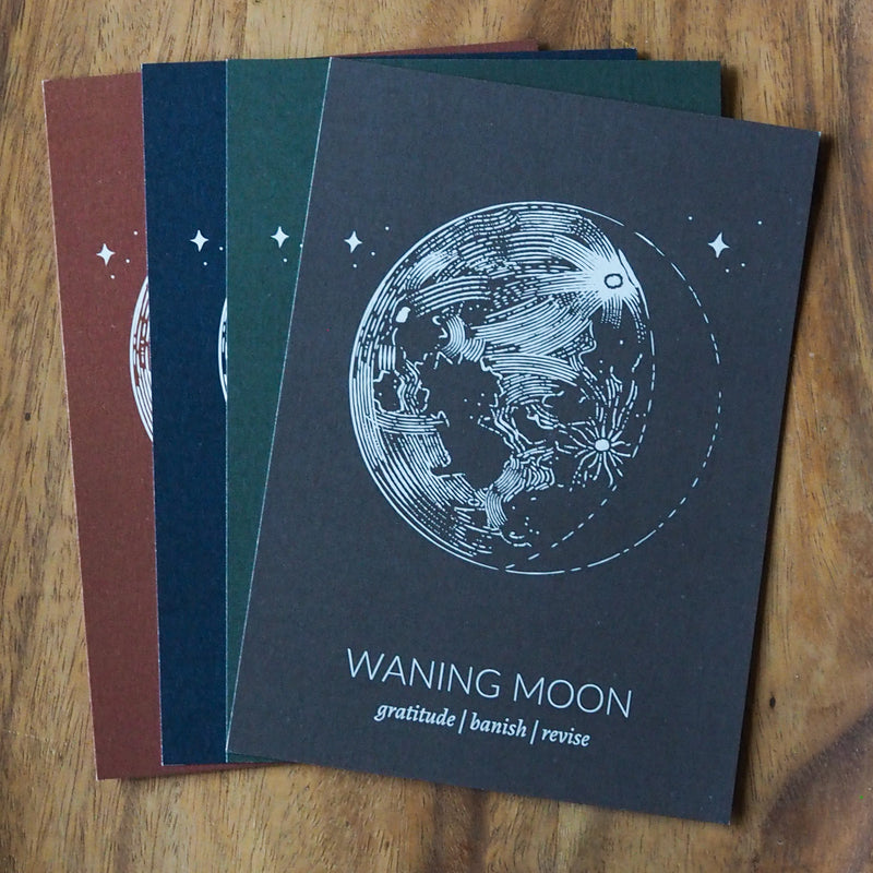 four waning moon lunar phase prints in different colors: rust, blue, green, grey