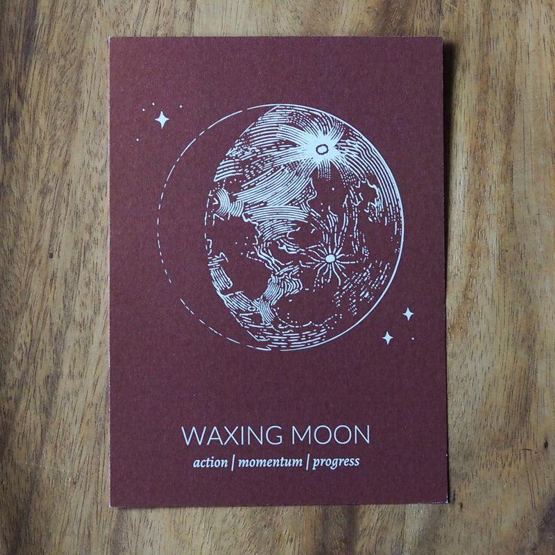 rust colored waxing moon lunar print on wooden background