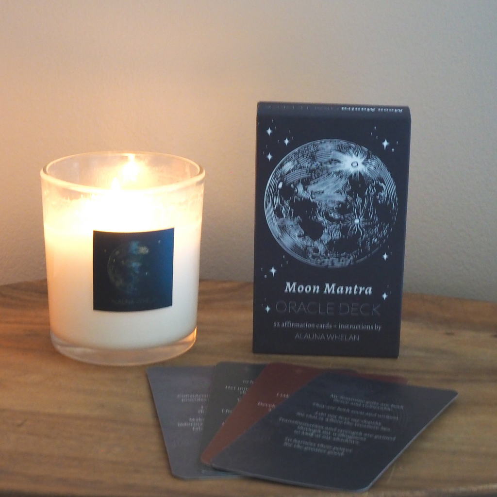 lit luxury soy moon candle with moon mantra oracle card deck