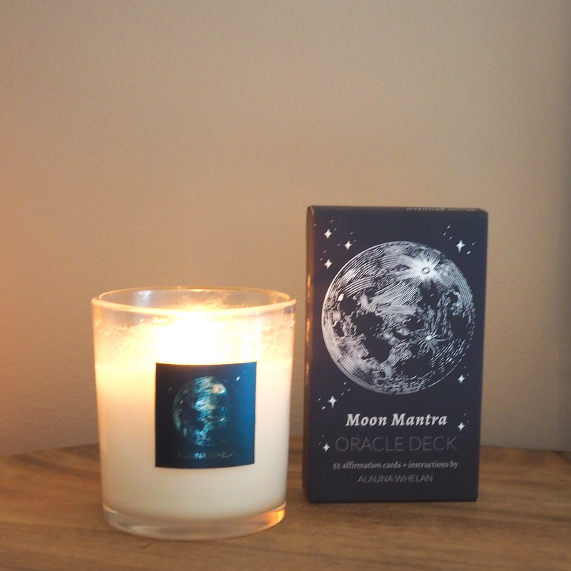 lit luxury soy moon candle with moon mantra oracle card deck