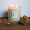 autumn spice luxury soy crystal candle on wooden table with gold details and fall foliage
